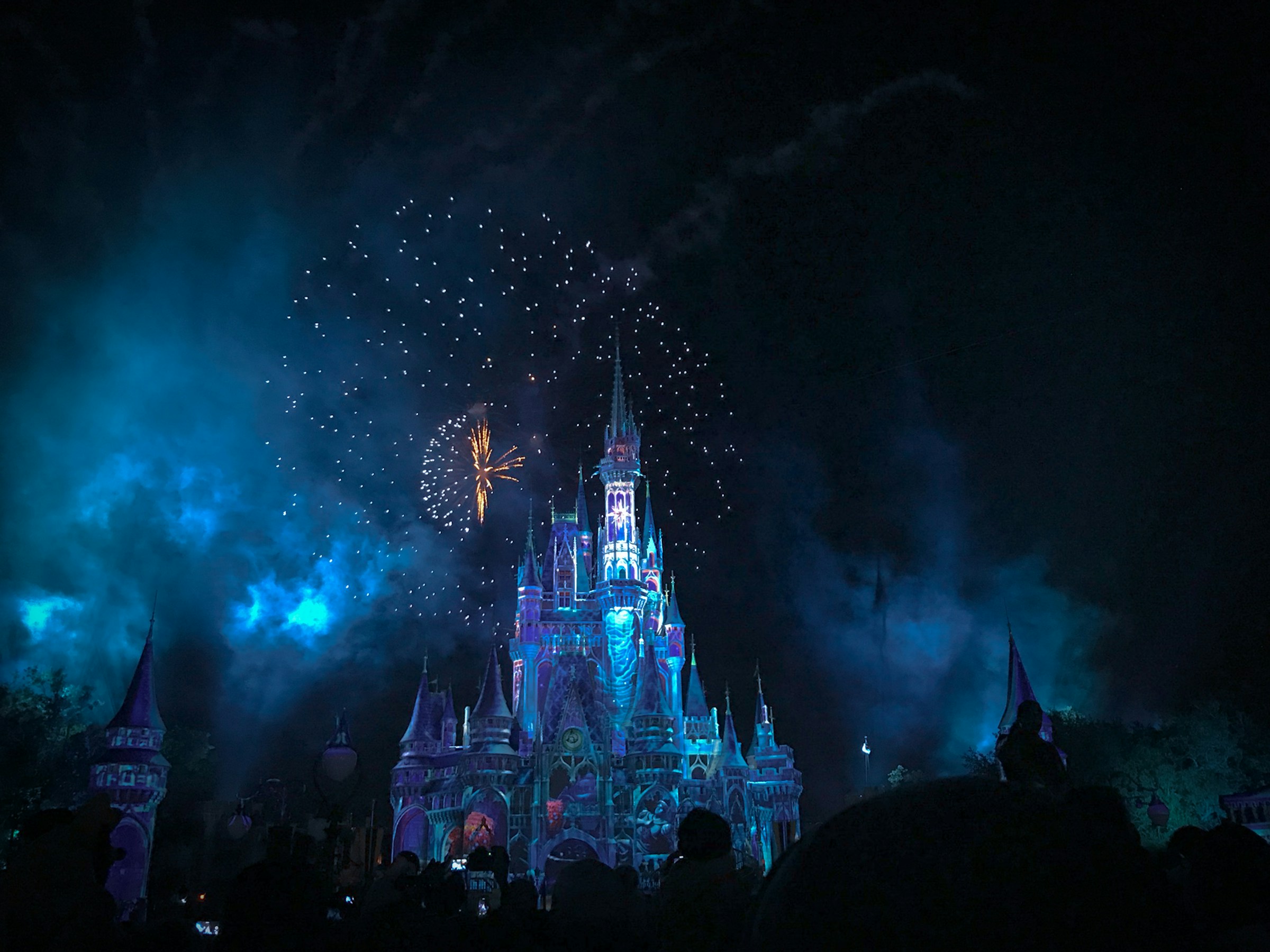 Fairy-tale castle above autumn forest