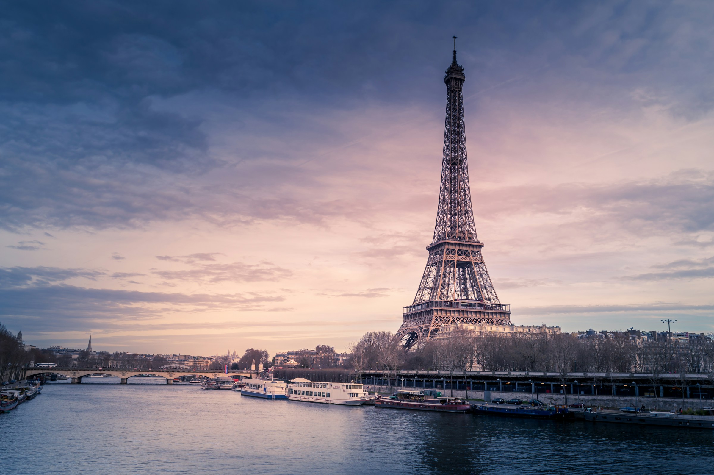 Paris rooftops and the Eiffel Tower at dusk